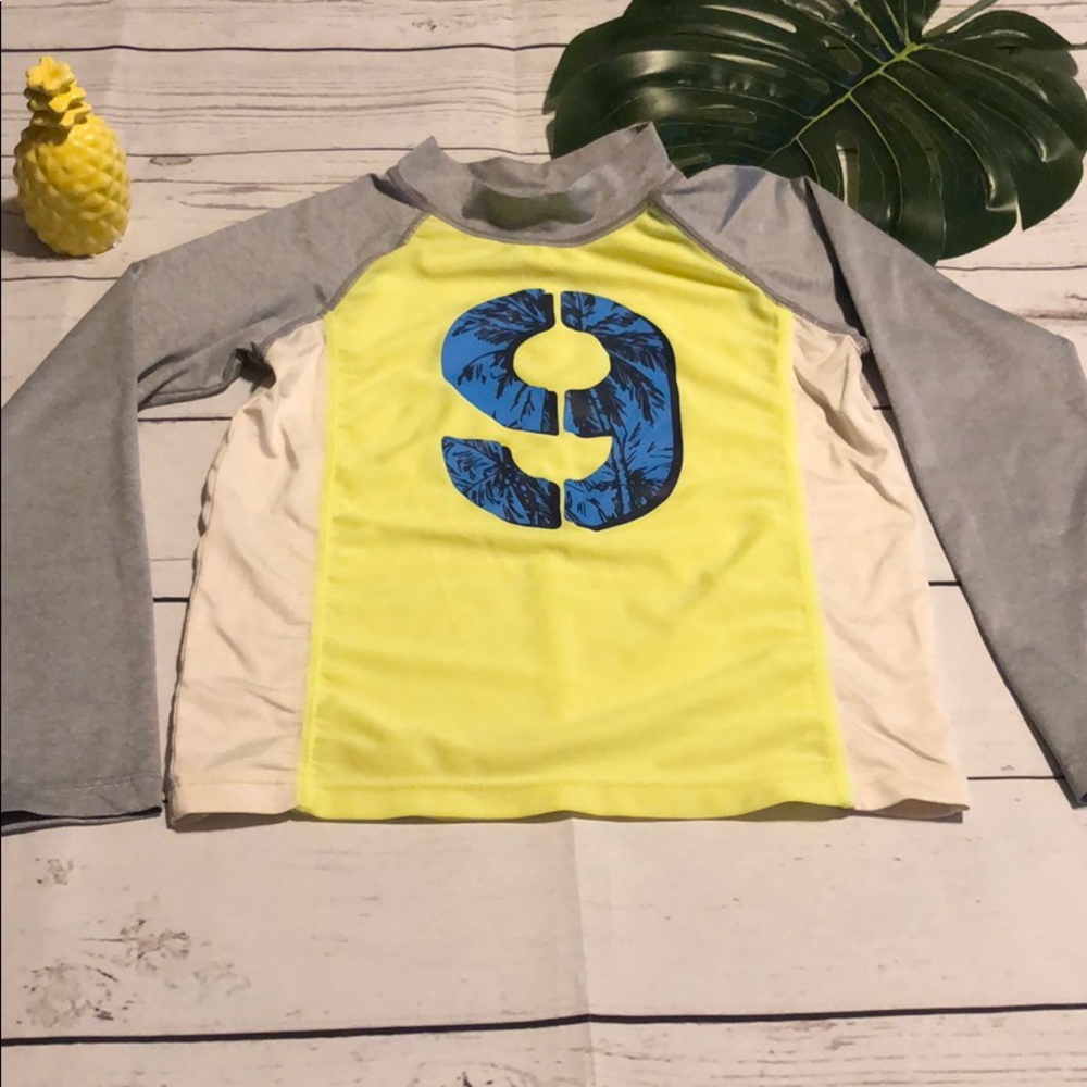 Oshkosh boys rashguard.